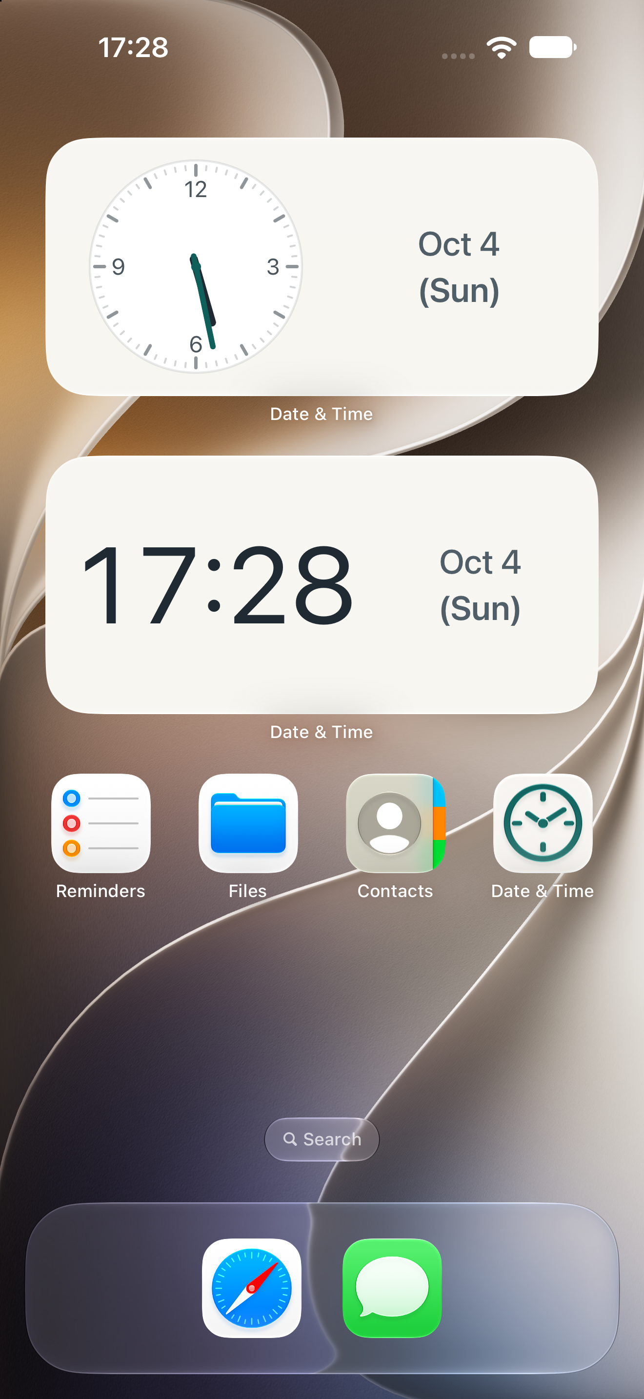 iPhone home screen with ivory analog and digital clock widgets showing the time, date, and day of the week
